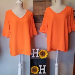 Neon coral ruffle sleeve top.